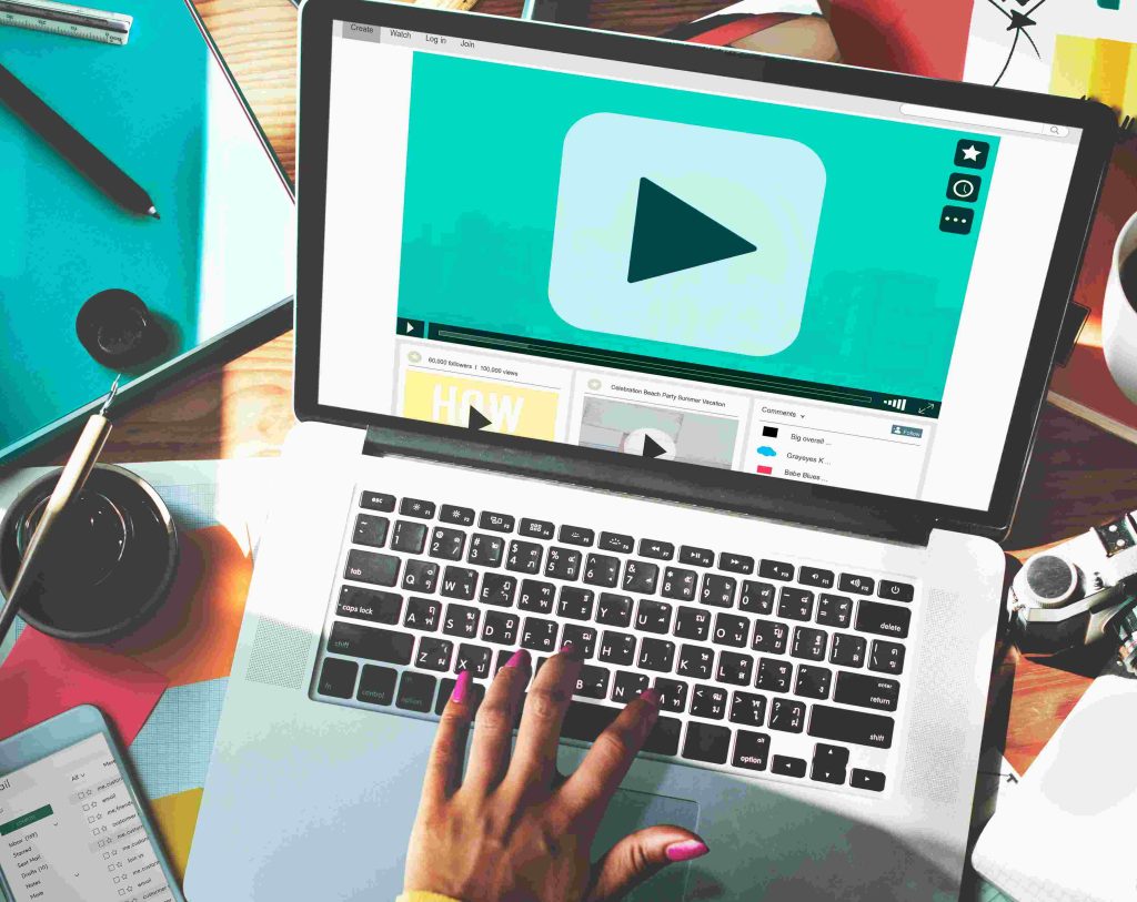 A laptop with play button screen